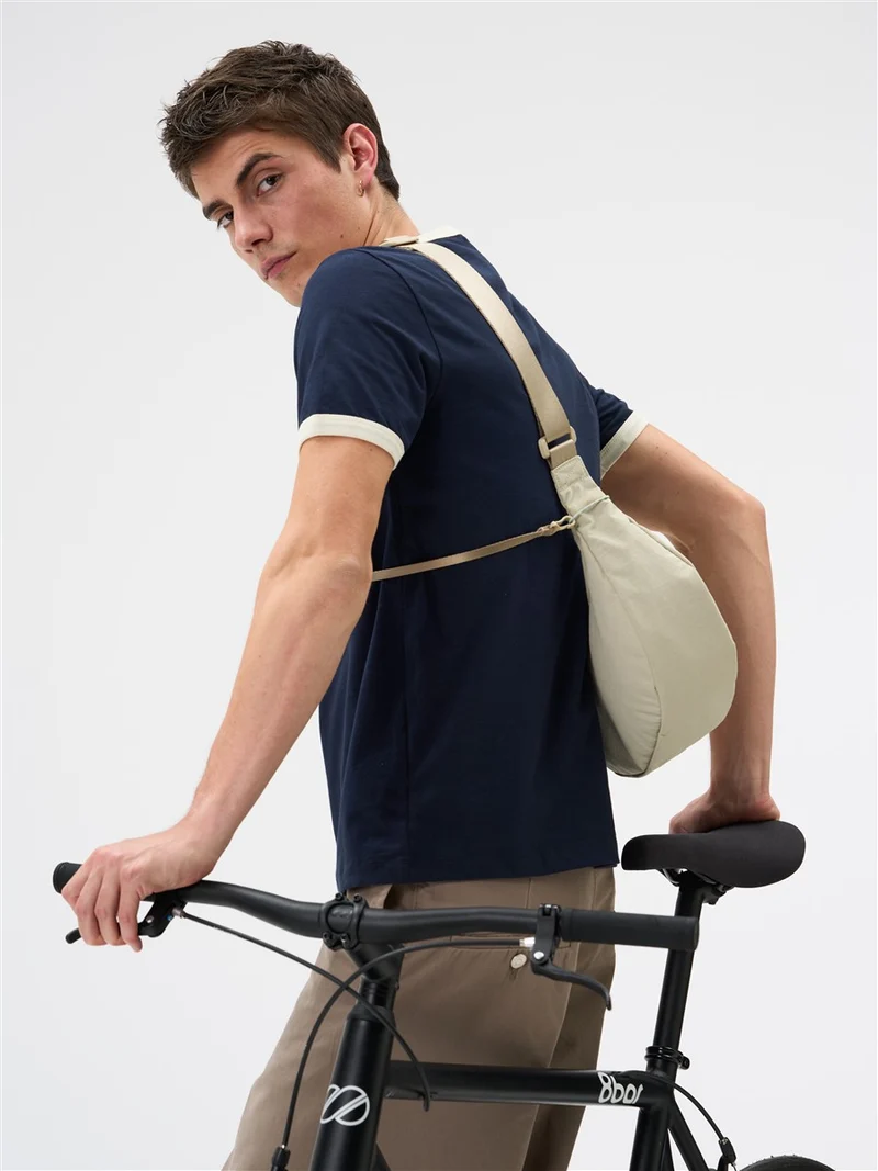 AEVOR Sling Bag Small Off-White